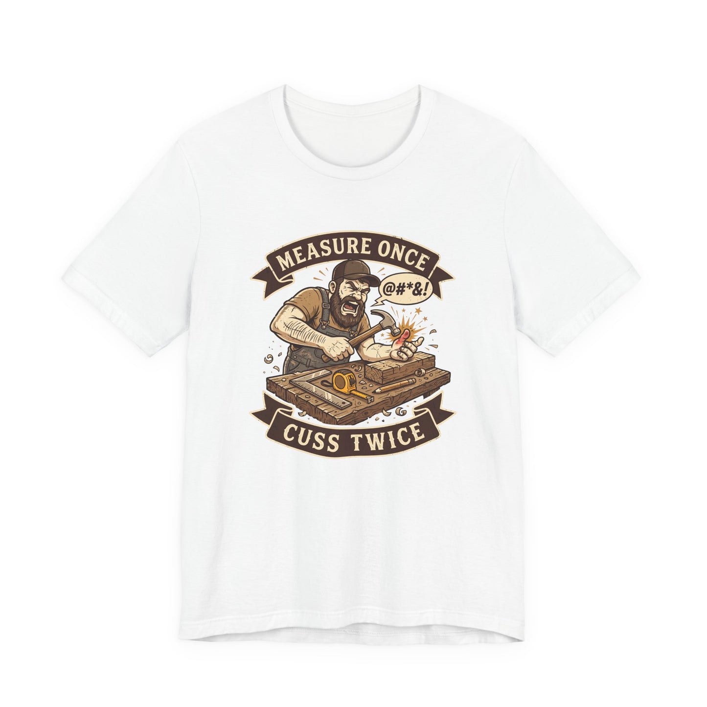 A white short-sleeve crewneck t-shirt featuring a vintage-style graphic print of a bearded man with tattoos working on a wooden chest, framed by banners reading 'MEASURE ONCE' and 'CUSS TWICE'.