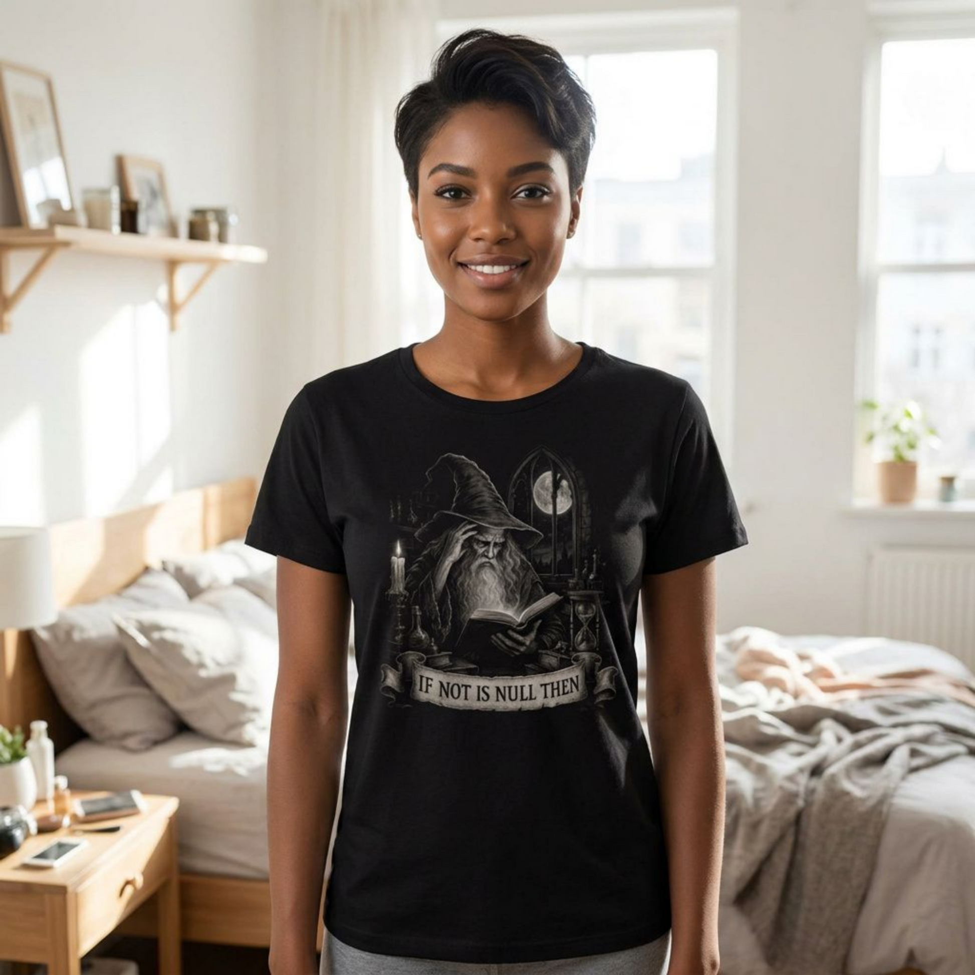 A woman wearing a black graphic t-shirt with a wizard illustration and the text 'IF NOT IS NULL THEN' stands in a brightly lit bedroom.